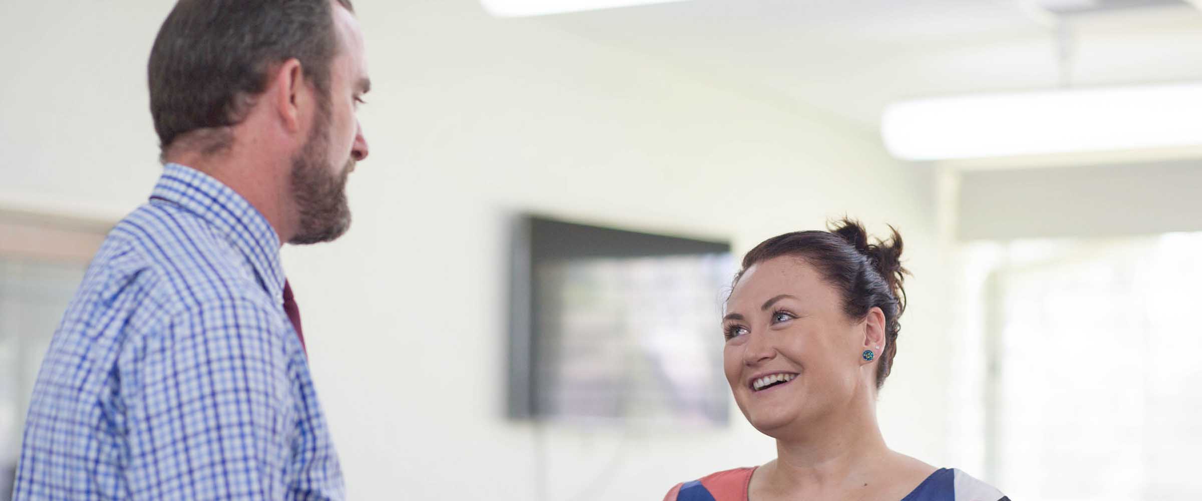 Senior educators signing a Statement of Commitment to embed mental health across the school.
