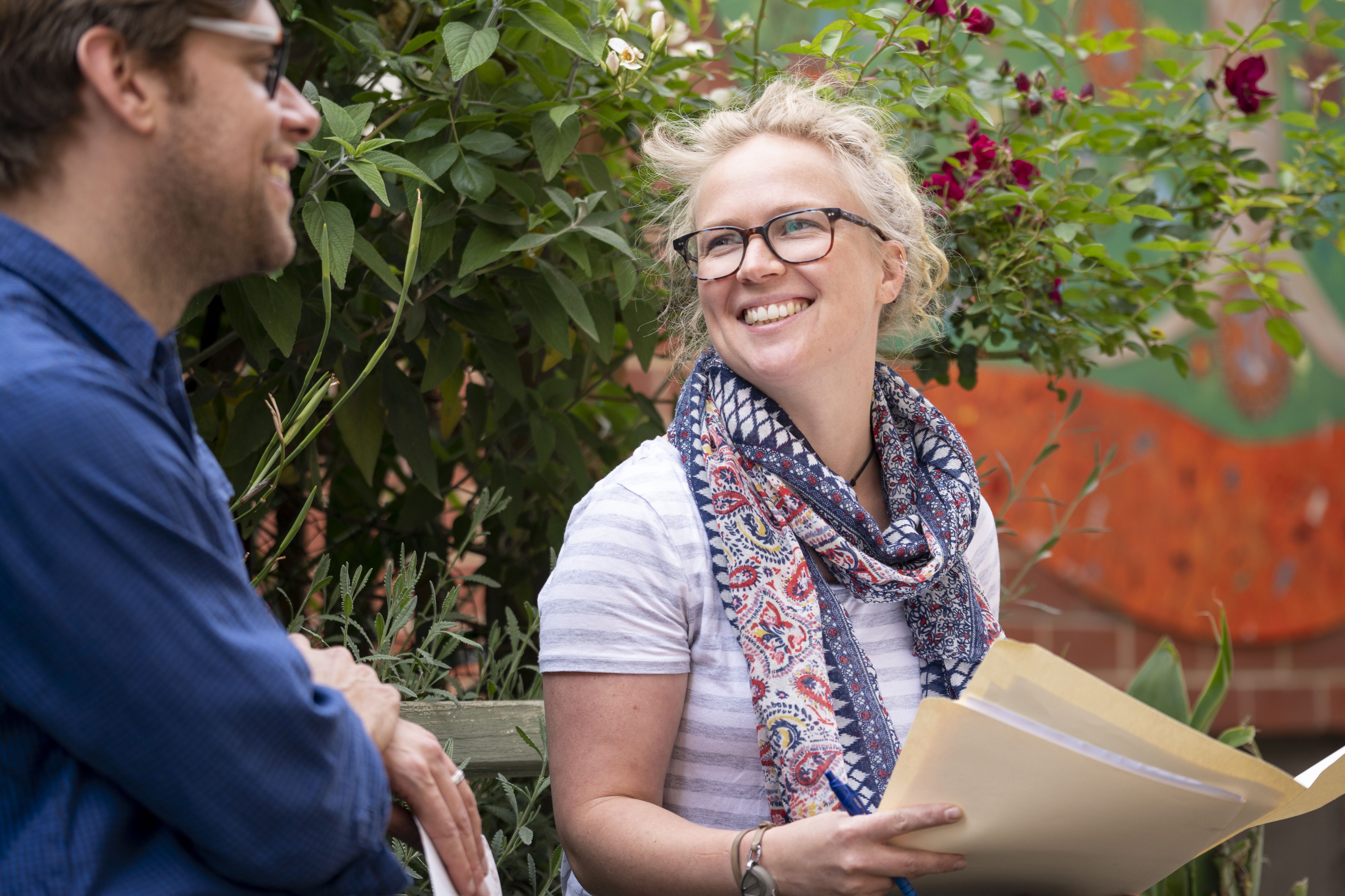 Two educators laughing together