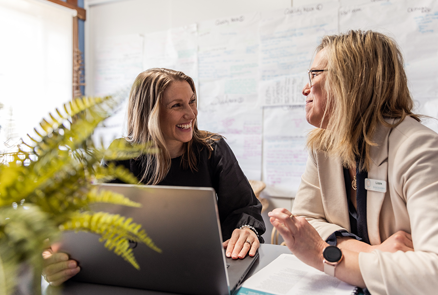 A pre-service educator talking to another educator