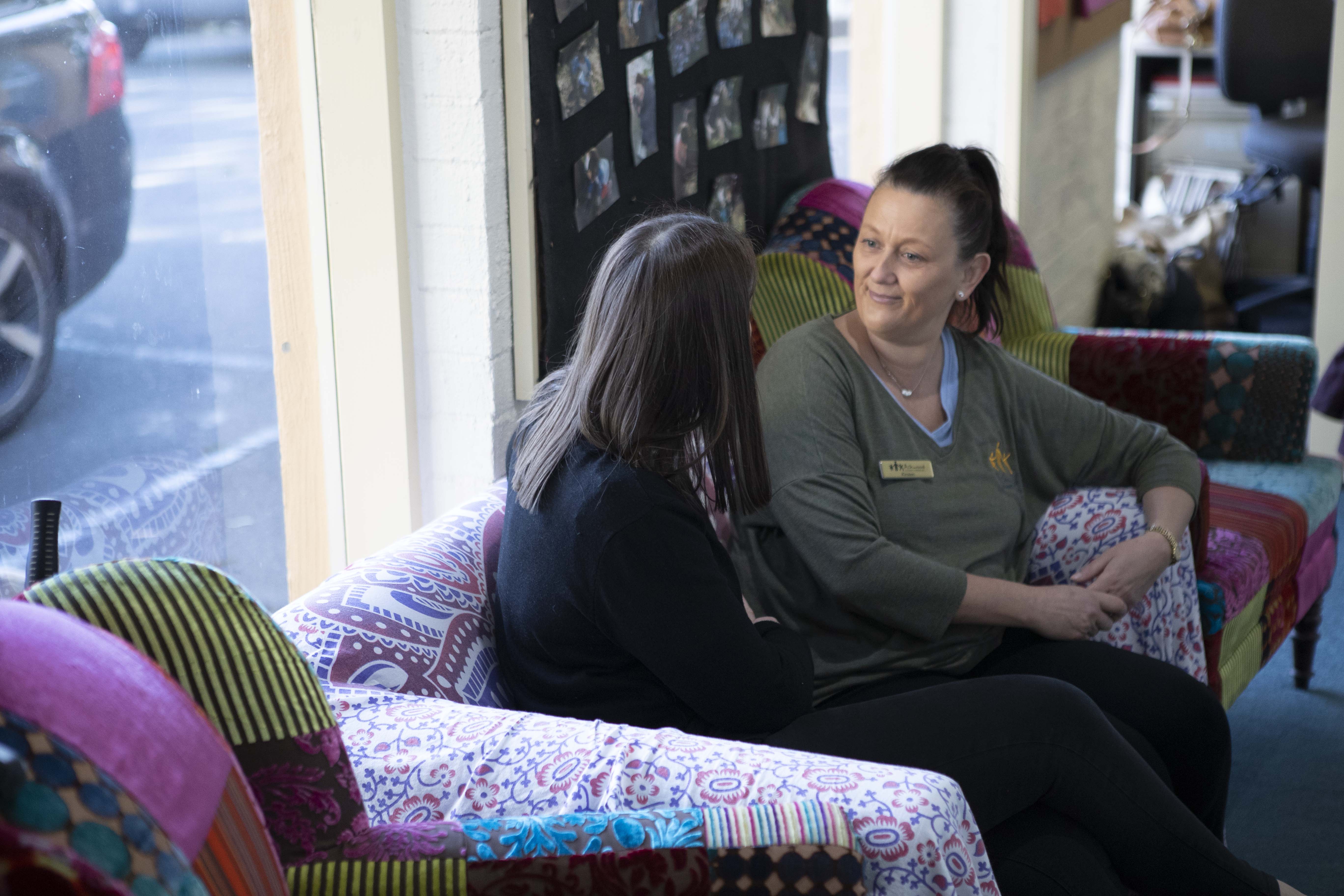 Educators talking on couch