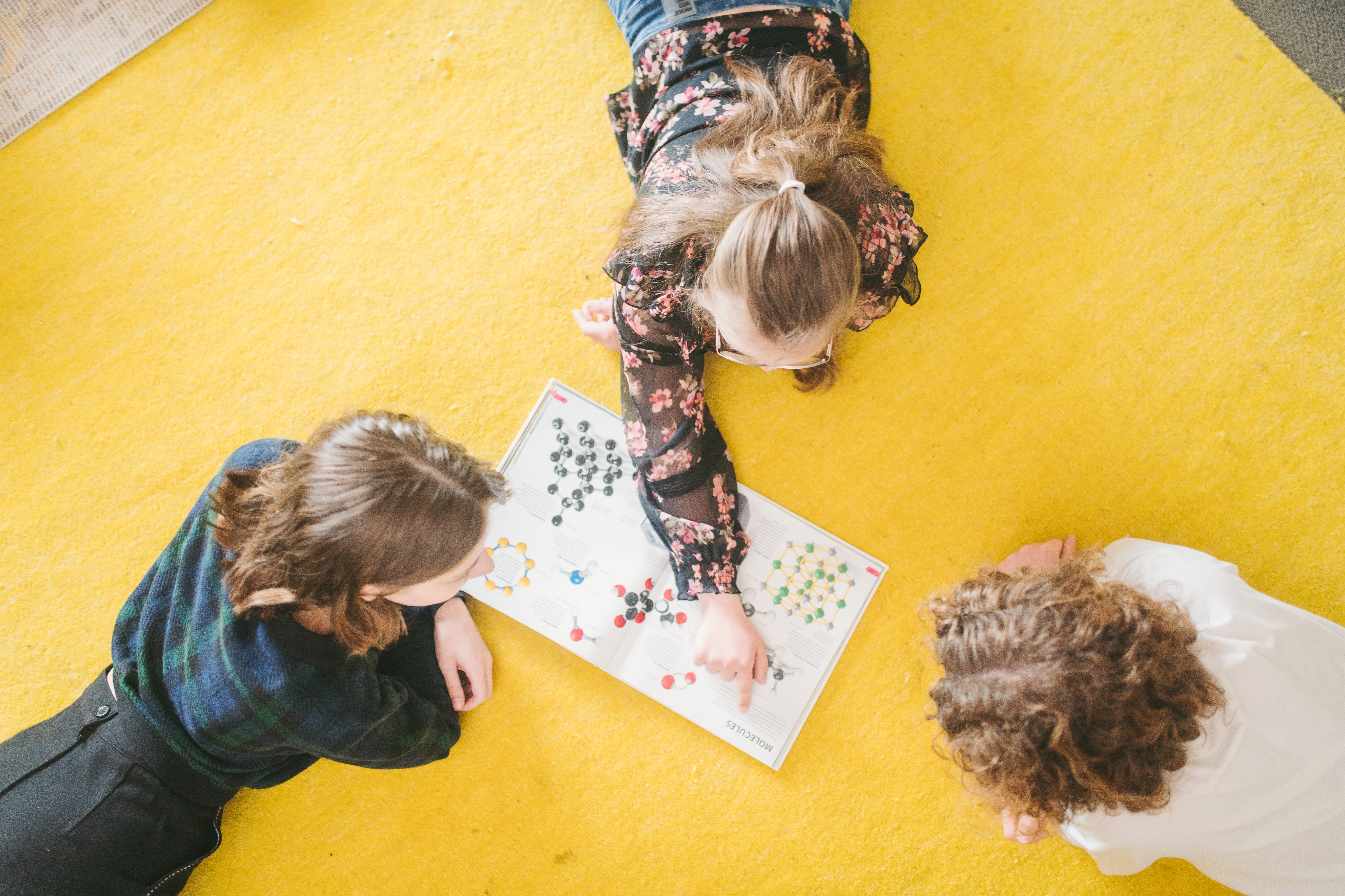 Three young children playing a game together